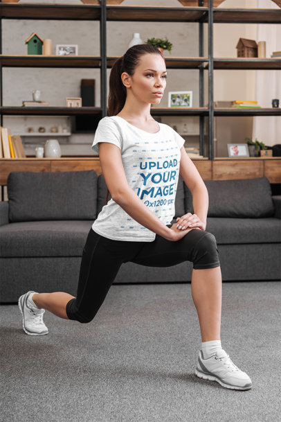 Activewear Mockup of a Woman With a Heather T-Shirt Exercising at Home