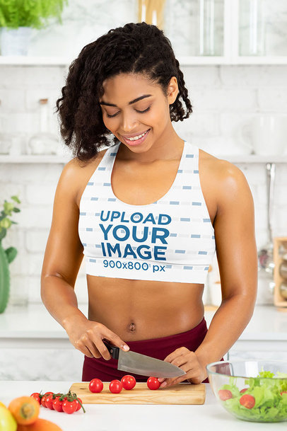 Sports Bra Mockup Featuring a Woman Chopping Vegetables for a Healthy Salad