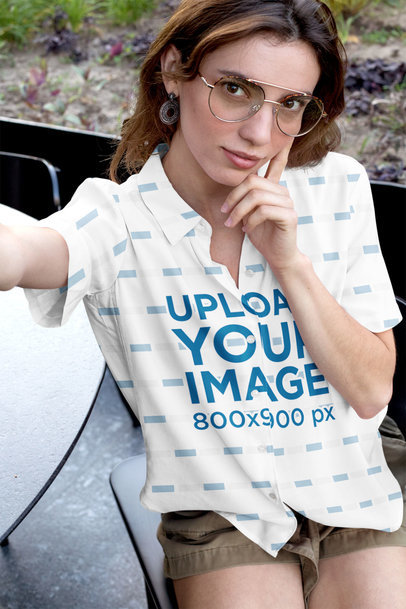 Mockup of a Woman Wearing a Sublimated Button-up Shirt Taking a Selfie 33130a