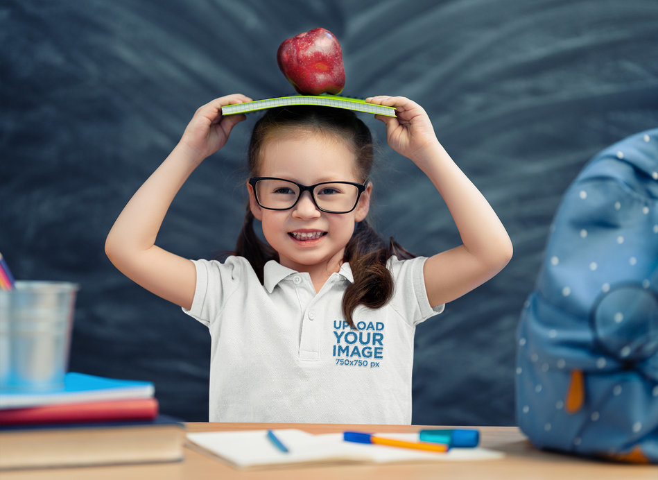 Polo Shirt Mockup of a Little Girl Acting Playful at School