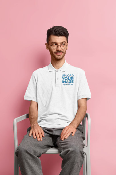 Polo Shirt Mockup of a Man Sitting in a Studio