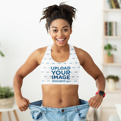 Sublimated Sports Bra Mockup of a Happy Young Woman Wearing Oversized Jeans