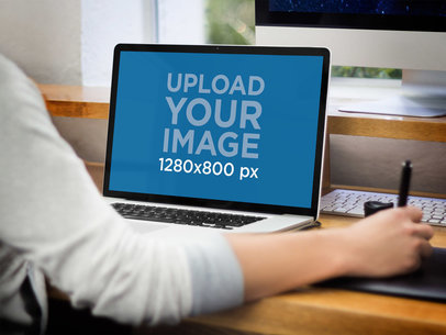 MacBook Pro Mockup Featuring a Woman Working on a Desk