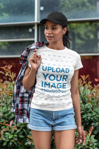 T-Shirt Mockup of a Woman in a Stylish Outfit Posing