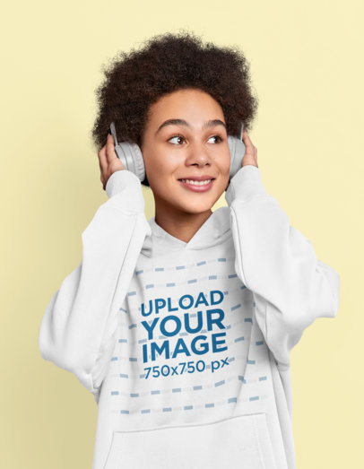 Pullover Hoodie Mockup Featuring a Young Woman Listening to a Happy Song