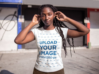 Mockup of a Woman Wearing a T-Shirt While Facing the Sun 