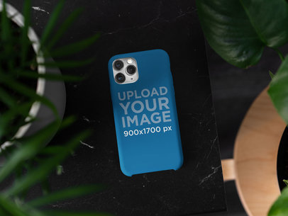 Mockup of a Phone Case Surrounded by Plants