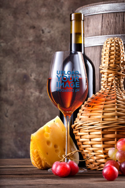 Mockup of a Customizable Wine Glass Surrounded by Cheese and Grapes 