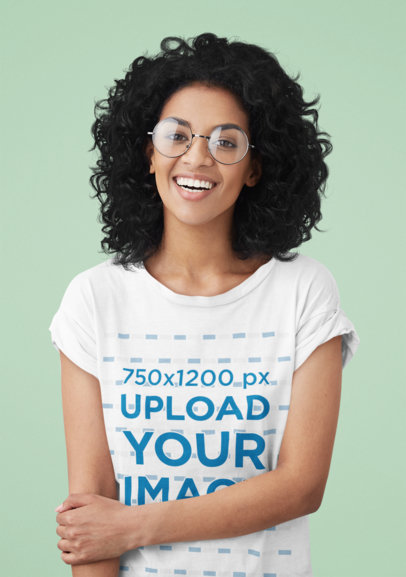 T-Shirt Mockup of a Curly-Haired Woman With Glasses in a Studio