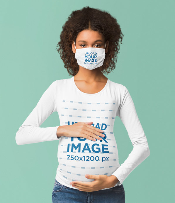 Long-Sleeve Tee Mockup of a Serious Pregnant Woman Wearing a Face Mask 