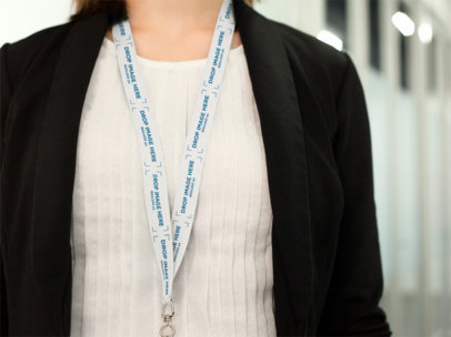Office Woman Using a Lanyard Mockup While Standing With a Cropped Face