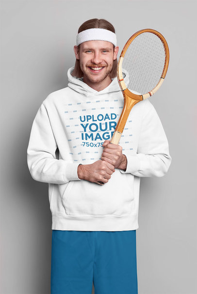 Hoodie Mockup of a Man Holding a Vintage Tennis Racket
