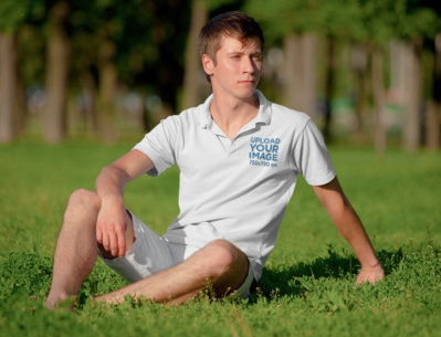 Polo Shirt Mockup Featuring a Young Man Posing at a Park m3003-r-el2