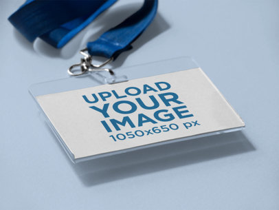 Angled Mockup of a Badge Holder Lying on a Solid Surface with a Holder