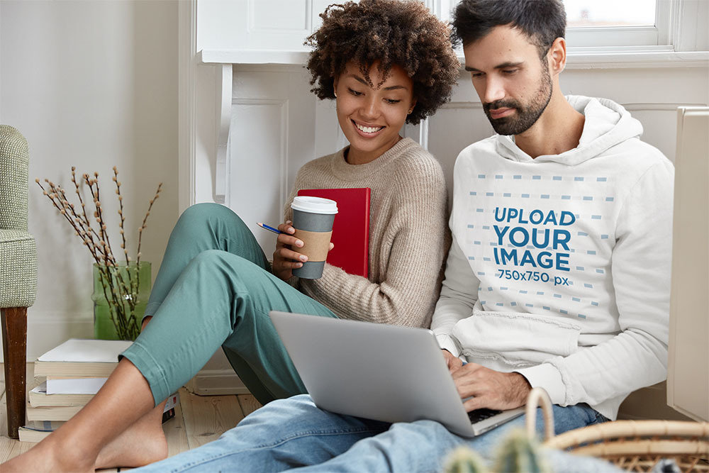 Hoodie Mockup of a Man Sitting Next to His Girlfriend