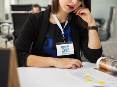 Young Woman Wearing a Badge Holder Mockup While Writing