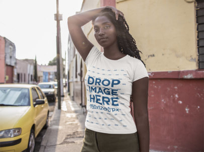 T-Shirt Mockup Being Worn by a Young Woman While on the Street 