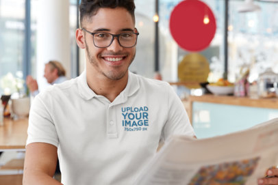 Polo Shirt Mockup of a Young Man Reading the Newspaper 