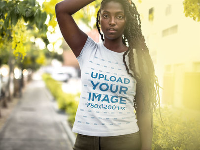 Woman Playing with her Hair While Outdoors Wearing a Round Neck Tee Mockup
