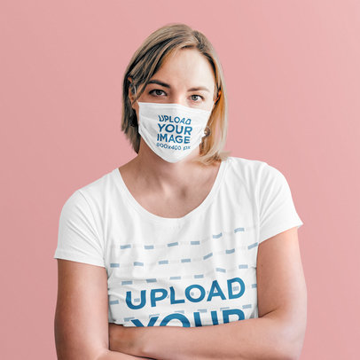 T-Shirt and Face Mask Mockup of a Woman with Crossed Arms at a Studio