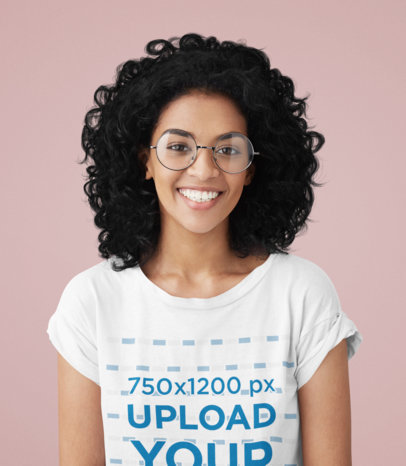 T-Shirt Mockup Featuring a Happy Woman With Glasses in a Studio