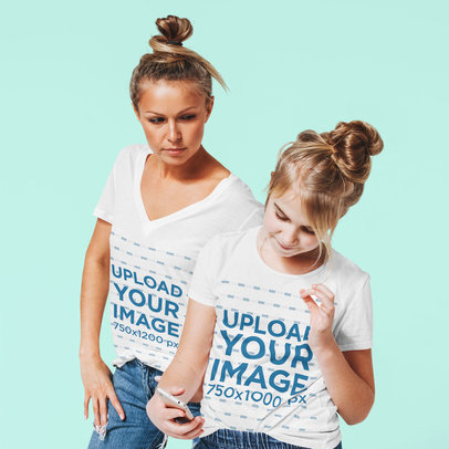 T-Shirt Mockup Featuring a Woman and a Girl in a Studio