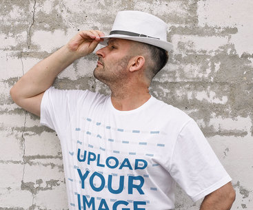 T-Shirt Mockup of a Serious Man Posing Against a Rustic Wall m2212-r-el2