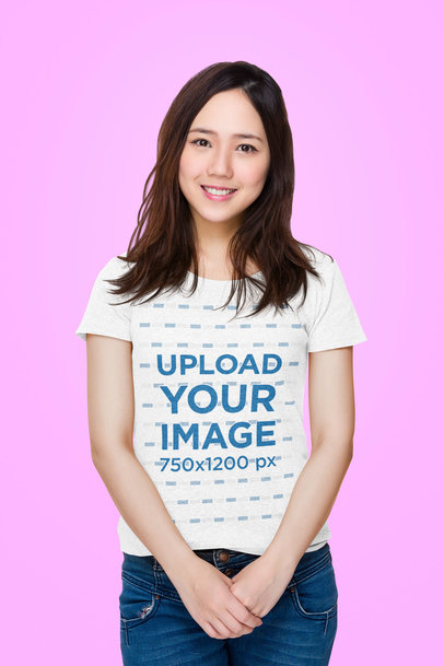 T-Shirt Mockup Featuring a Shy Woman Standing in a Studio