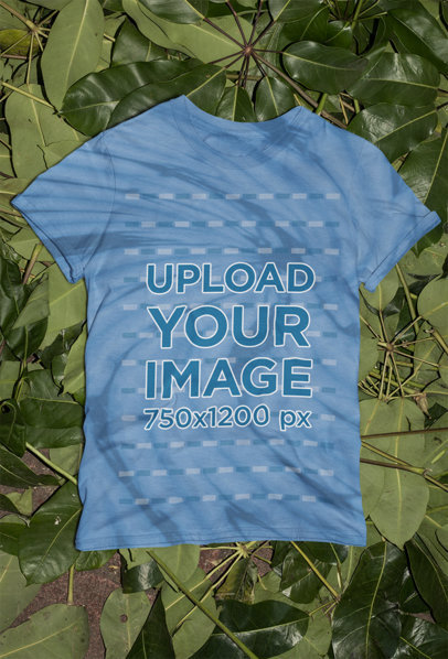Mockup of a Tie-Dye T-Shirt Flat Laid over Green Leaves m4033