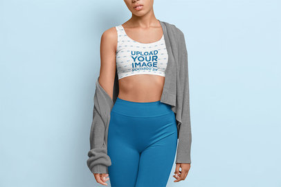 Sports Bra Mockup Featuring a Serious Woman Standing in a Studio