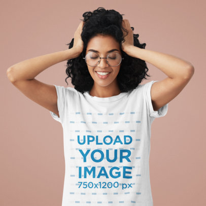 T-Shirt Mockup of a Woman with Glasses in a Studio