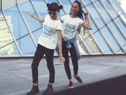 Two Women Playing While Wearing Different Tees Mockup in the City