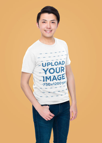 Basic T-Shirt Mockup Featuring a Happy Man Posing Against a Colored Wall