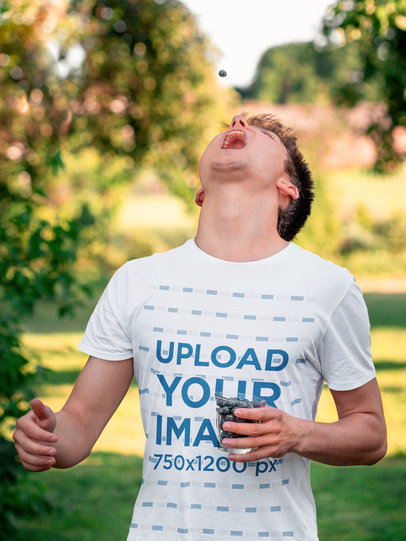 T-Shirt Mockup of a Man Eating Blueberries m2448-r-el2
