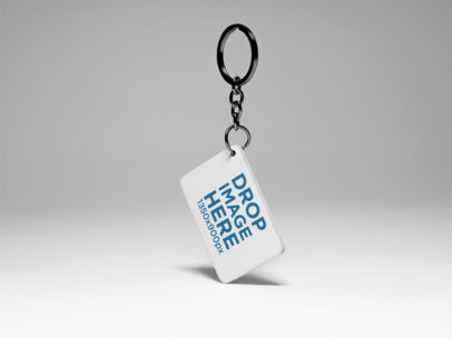 Keychain Template Standing About to Float Over a Solid Color Surface