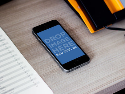 iPhone Mockup iPhone 5s Space Grey at Hotel Desk