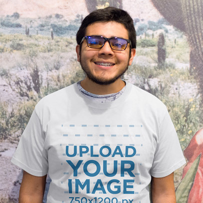 Happy Young Customer Wearing a Tee Mockup While Standing a15664