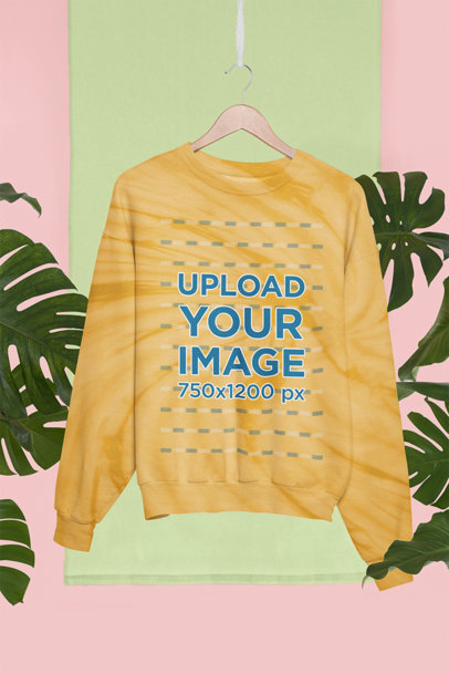 Mockup of a Tie-Dye Sweatshirt Hanging in a Tropical Setting m4126