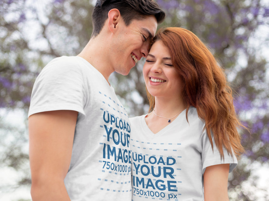 Romantic Young Couple Wearing a Round Neck and a V-Neck Tshirt Mockup while Outdoors