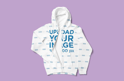 Mockup of a Full-Zip Hoodie Tossed Over a Plain Color Surface 5041-el1