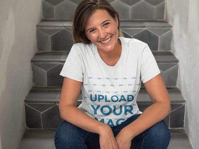 Very Happy Middle Aged Woman Sitting Down on Stairways Wearing a Round Neck T-Shirt Template