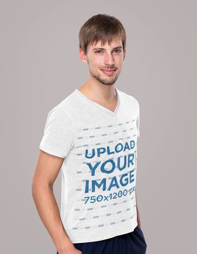 Mockup of a Bearded Man Wearing a Heather T-Shirt at a Studio 