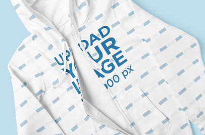 Closeup Mockup of a Sublimated Full-Zip Hoodie Placed On a Colored Surface 