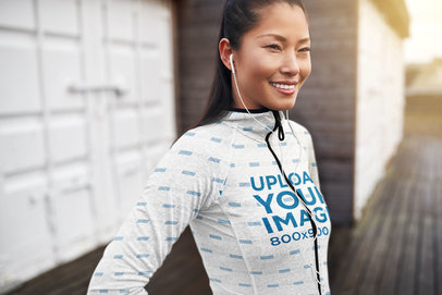 Sublimated Full-Zip Hoodie Mockup of a Happy Woman Posing 