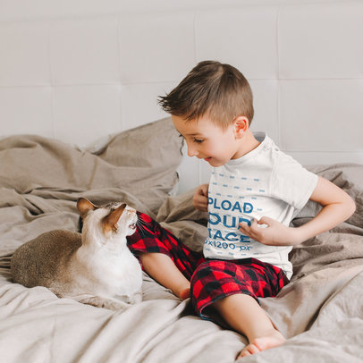 T-Shirt Mockup of a Little Kid Having Fun with His Cat