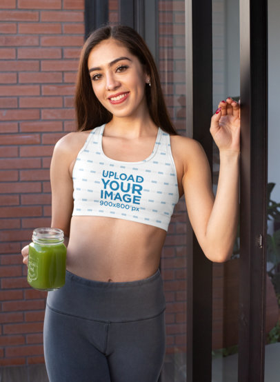 Sports Bra Mockup of a Young Woman Holding a Healthy Smoothie 