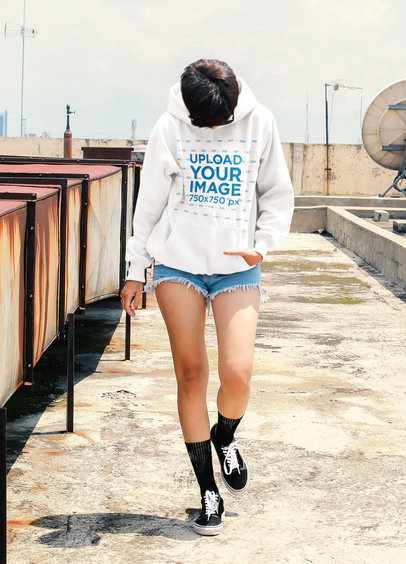 Hoodie Mockup of a Short-Haired Woman on the Rooftop of a Building