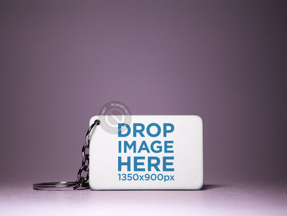Keychain Mockup Standing on a Dark Purple Surface