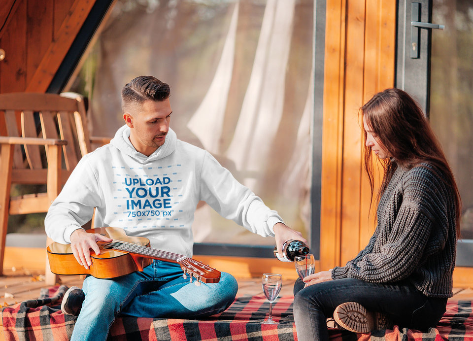 Hoodie Mockup of a Man on a Date at a Cabin