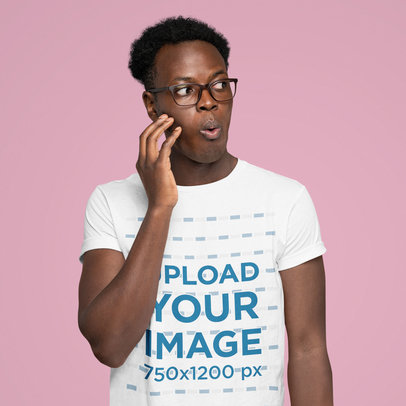 T-Shirt Mockup of a Surprised Man at a Studio